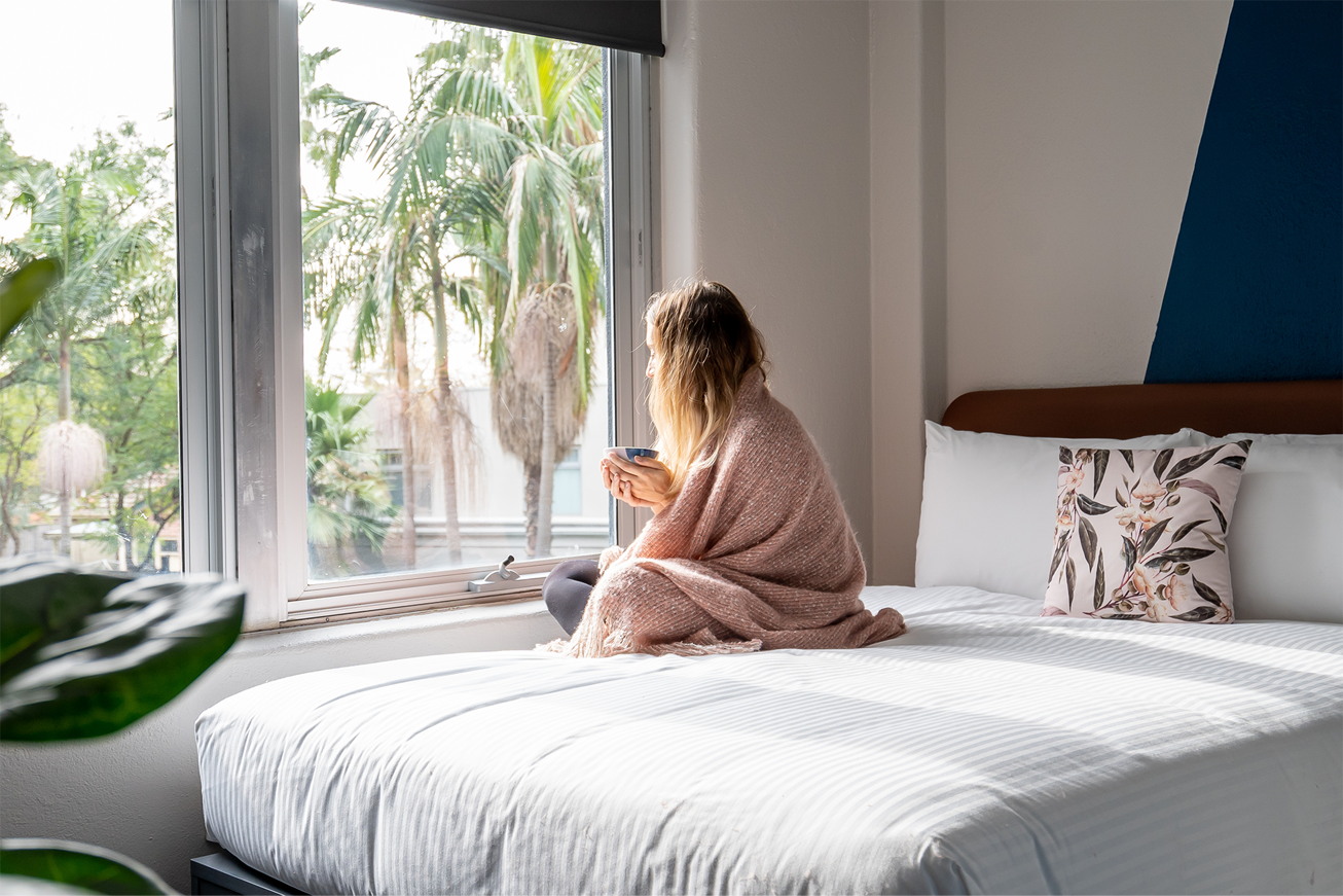 Resident relaxing in room at Together Co-Living Melbourne